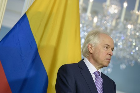 Bernard Aronson listens while US Secretary of State John Kerry speaks at the US State Department February 20, 2015 in Washington, DC. Kerry announced that Bernard Aronson will join the State Department as Special Envoy for the Colombian Peace Process. AFP PHOTO/BRENDAN SMIALOWSKI        (Photo credit should read BRENDAN SMIALOWSKI/AFP/Getty Images)