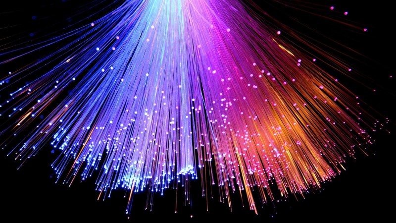 Illuminated Fiber Optic Against Black Background