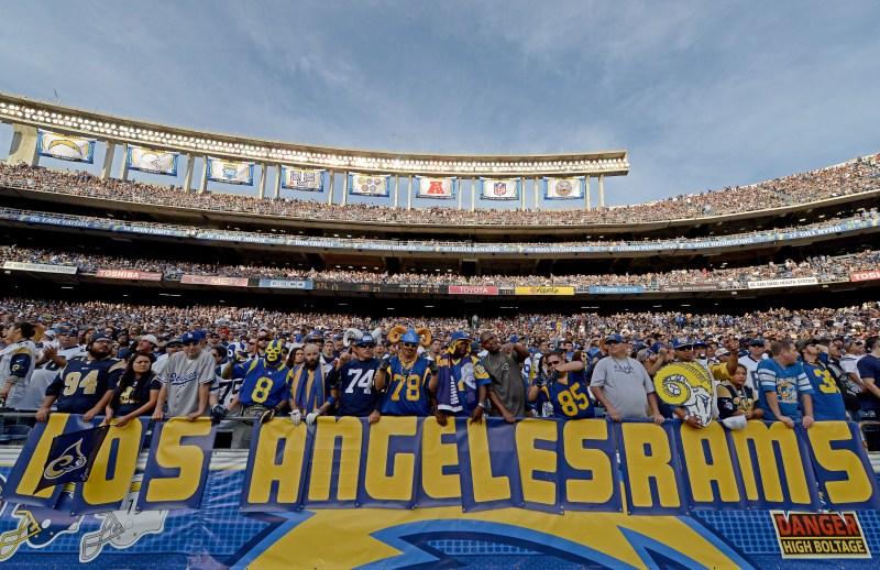 SAN DIEGO, CA - NOVEMBER 23: Fans of the St. Louis Rams hold a "Los Angeles Rams" sign against the San Diego Chargers during their NFL Game on November 23, 2014 in San Diego, California. (Photo by Donald Miralle/Getty Images)