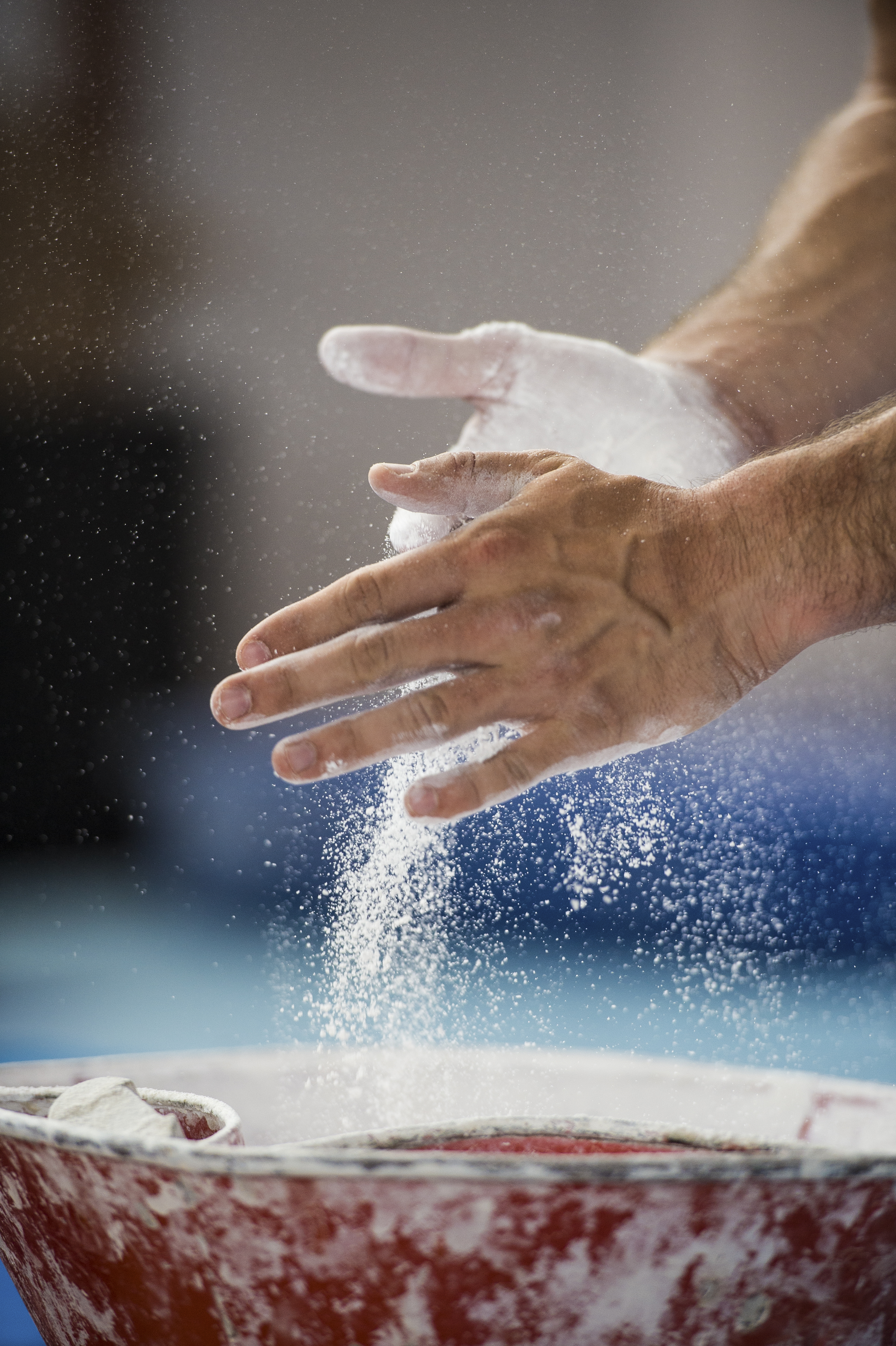 Male gymnast preparing for performance on the side horse