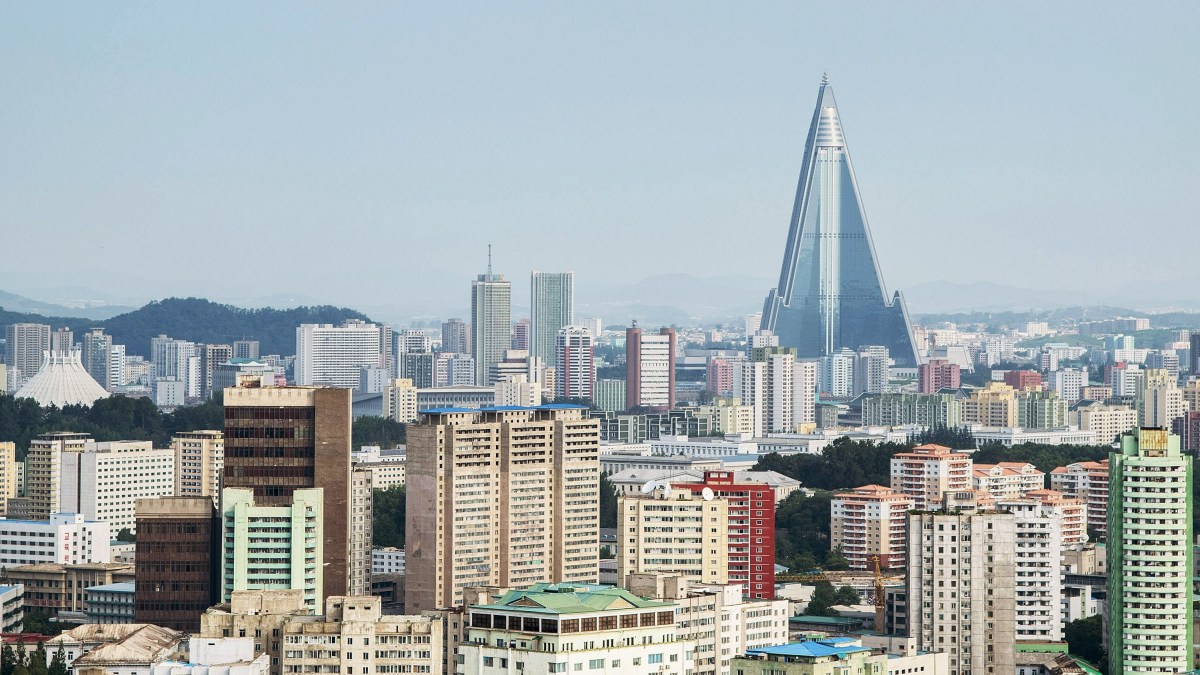 PYONGYANG, NORTH KOREA - AUGUST 24:  A view of the Pyongyang cityscape, looking towards the Ryugyong Hotel Tower from Yanggakdo Hotel on August 24, 2015 in Pyongyang, North Korea. North and South Korea today came to an agreement to ease tensions following an exchange of artillery fire at the demilitarized border last week.  (Photo by Xiaolu Chu/Getty Images)