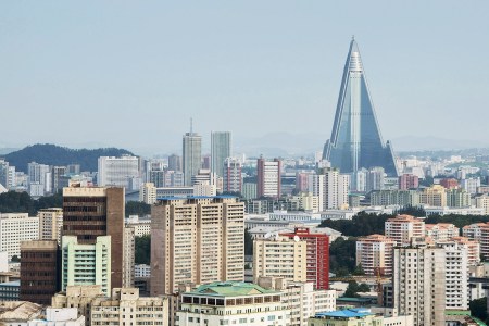 PYONGYANG, NORTH KOREA - AUGUST 24:  A view of the Pyongyang cityscape, looking towards the Ryugyong Hotel Tower from Yanggakdo Hotel on August 24, 2015 in Pyongyang, North Korea. North and South Korea today came to an agreement to ease tensions following an exchange of artillery fire at the demilitarized border last week.  (Photo by Xiaolu Chu/Getty Images)