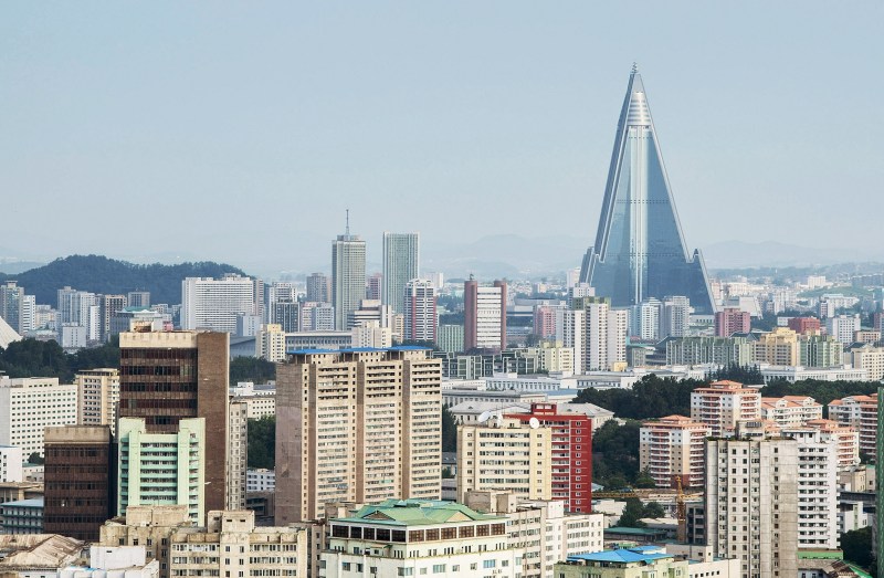 PYONGYANG, NORTH KOREA - AUGUST 24: A view of the Pyongyang cityscape, looking towards the Ryugyong Hotel Tower from Yanggakdo Hotel on August 24, 2015 in Pyongyang, North Korea. North and South Korea today came to an agreement to ease tensions following an exchange of artillery fire at the demilitarized border last week. (Photo by Xiaolu Chu/Getty Images)