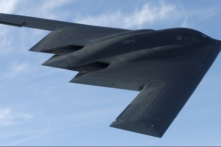 IN FLIGHT - MAY 8:  The bat-shaped B-2 stealth bomber with its flying wing design flies over Whiteman Air Force Base May 8, 2003 near Knob Noster, Missouri.  Whiteman is the home of the B-2's, of which there are only about twenty.  Each B-2 is worth about $2 million USD.  With the Wright Brothers' historic flight celebrating its centennial in 2003, the world is now poised on the threshold of a new age in aviation, one where super-sonic jets refuel in flight, unmanned aerial vehicles track objects with astonishing accuracy, and airliners are maneuvered at times with minimal human participation.  The computer age is about to revolutionize aviation and the United States is unquestionably ahead of the curve in this revolution.  (Photo by Joe McNally/Getty Images)