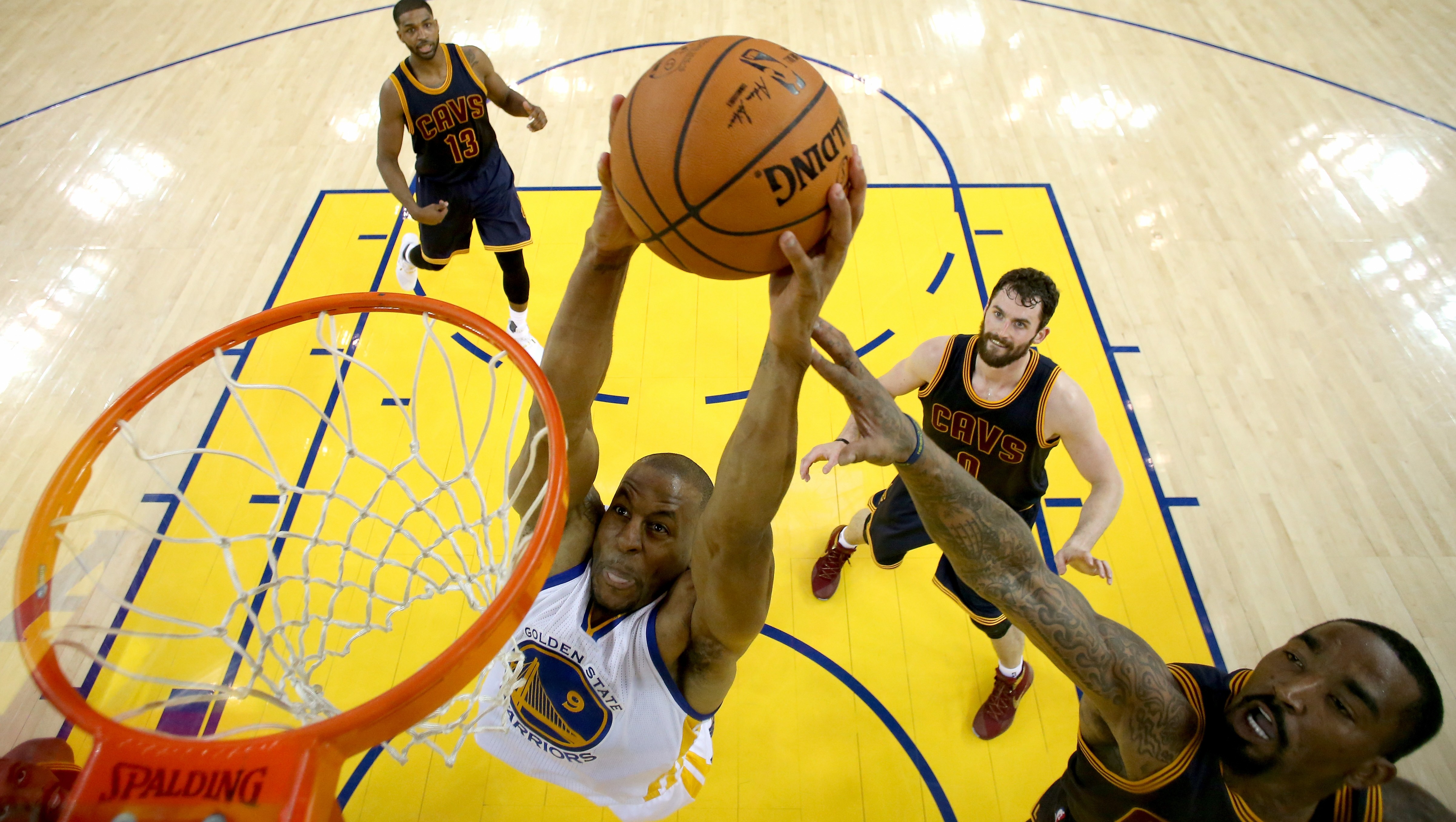 OAKLAND, CA - JUNE 02: Andre Iguodala #9 of the Golden State Warriors goes up to dunk the ball against J.R. Smith #5 of the Cleveland Cavaliers in the first half in Game 1 of the 2016 NBA Finals at ORACLE Arena on June 2, 2016 in Oakland, California. NOTE TO USER: User expressly acknowledges and agrees that, by downloading and or using this photograph, User is consenting to the terms and conditions of the Getty Images License Agreement. (Photo by Ezra Shaw/Getty Images)