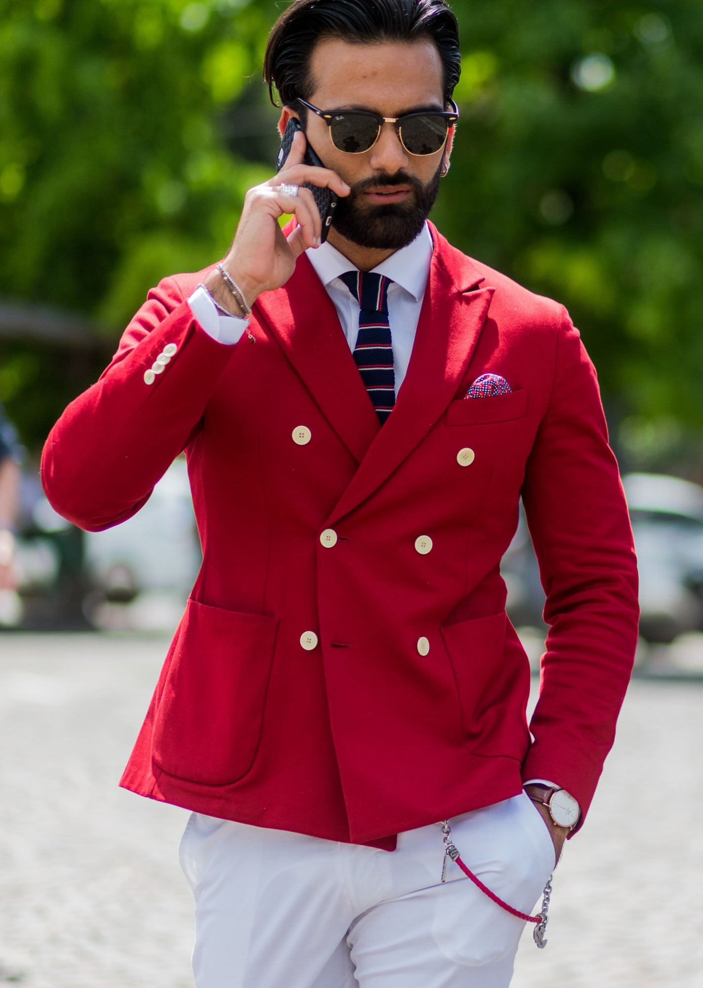 FLORENCE, ITALY - JUNE 15: Guests wearing a red and blue blazer and white pants during Pitti Uomo 90 on June 15, 2016, in Florence, Italy (Photo by Christian Vierig/Getty Images)