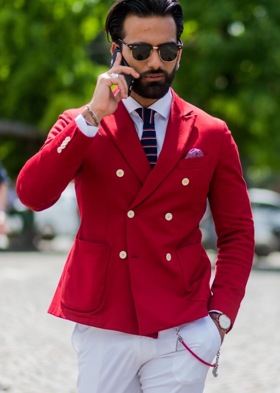 FLORENCE, ITALY - JUNE 15: Guests wearing a red and blue blazer and white pants during Pitti Uomo 90 on June 15, 2016, in Florence, Italy (Photo by Christian Vierig/Getty Images)