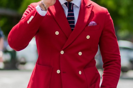 FLORENCE, ITALY - JUNE 15: Guests wearing a red and blue blazer and white pants during Pitti Uomo 90 on June 15, 2016, in Florence, Italy (Photo by Christian Vierig/Getty Images)