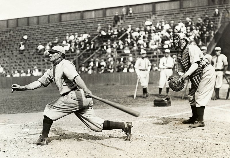 American baseball player, John Peter "Honus" Wagner (1874-1955) swinging bat at game. Undated photograph. (Photo by George Rinhart/Corbis via Getty Images)