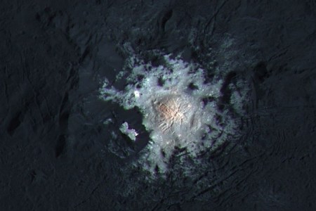 The bright spots of Occator Crater are shown in enhanced color in this view from NASA's Dawn spacecraft. Such views can be used to highlight subtle color differences on Ceres' surface.(NASA/JPL-Caltech/UCLA/MPS/DLR/IDA/PSI/LPI)