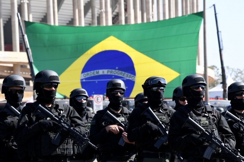 TOPSHOT - Brazilian army special forces participate in the ceremony to present the integrated security forces for the ten Rio 2016 Olympic Games football matches that will be played at the Mane Garrincha national Stadium in Brasilia, on 22 July 20016. The security of the Olympic matches will be taken in charge from next Sunday on by 4,500 agents, between soldiers, police officers, firefighters and Traffic department personnel / AFP / EVARISTO SA (Photo credit should read EVARISTO SA/AFP/Getty Images)