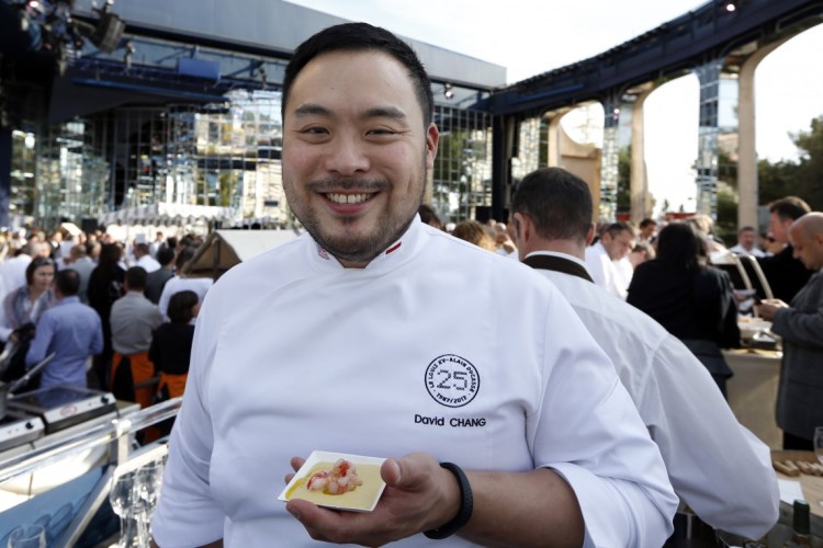 David Chang poses during the festivities marking the 25th anniversary of French chef Alain Ducasse's restaurant "Le Louis XV", on November 17, 2012 in Monaco. (AFP PHOTO / VALERY HACHE)