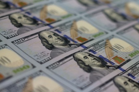 Newly redesigned $100 notes lay in stacks at the Bureau of Engraving and Printing on May 20, 2013 in Washington, DC. The one hundred dollar bills will be released this fall and has new security features, such as a duplicating portrait of Benjamin Franklin and microprinting added to make the bill more difficult to counterfeit.  (Mark Wilson/Getty Images)