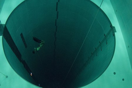 A student swims during an apnea course by Italian free diver, Umberto Pelizzari, at the "Y-40 The Deep Joy" swimming pool on December 8, 2014 in Montegrotto Terme, northeastern Italy. The swimming pool is built over thermal sources bringing after cooling down a water at 32-34 degrees Celsius. Y-40, with its depth of 42mt, is officially included in the Guinness World Record as the deepest pool in the world for free and scuba diving.  AFP PHOTO / OLIVIER MORIN        (Photo credit should read OLIVIER MORIN/AFP/Getty Images)