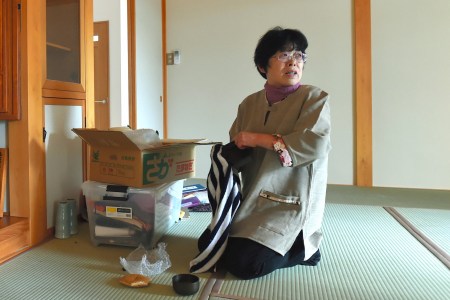 Kaneko Takahara, 66, sits on newly furbished tatami mat as she returns her home at former no-go zone of the crippled Fukushima Daiichi Nuclear Power Plant in Naraha. (The Asahi Shimbun via Getty Images)