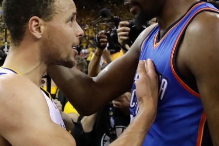 OAKLAND, CA - MAY 30:  Stephen Curry #30 of the Golden State Warriors speaks with Kevin Durant #35 of the Oklahoma City Thunder after their 96-88 win in Game Seven of the Western Conference Finals during the 2016 NBA Playoffs at ORACLE Arena on May 30, 2016 in Oakland, California. NOTE TO USER: User expressly acknowledges and agrees that, by downloading and or using this photograph, User is consenting to the terms and conditions of the Getty Images License Agreement.  (Photo by Ezra Shaw/Getty Images)