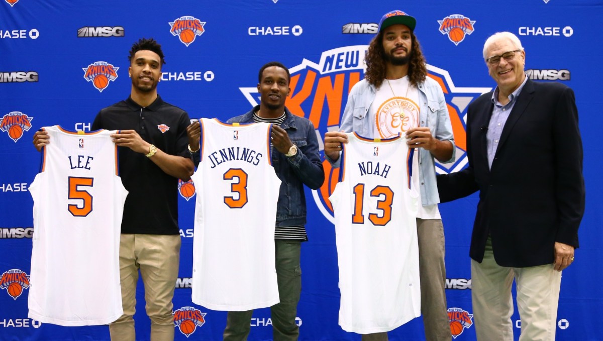 GREENSBURGH, NY - JULY 08:  Courtney Lee, Joakim Noah, and Brandon Jennings and President Phil Jackson of the New York Knicks attend a press conference at the Madison Square Garden Training Facility on July 8, 2016 in Greenburgh, New York. NOTE TO USER: User expressly acknowledges and agrees that, by downloading and or using this photograph, User is consenting to the terms and conditions of the Getty Images License Agreement. Mandatory Copyright Notice: Copyright 2016 NBAE (Photo by Nathaniel S. Butler/NBAE via Getty Images)