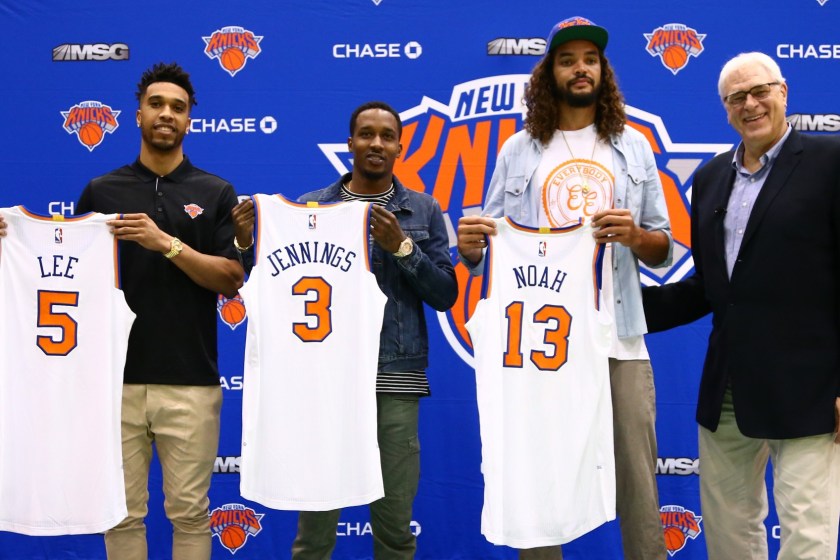 GREENSBURGH, NY - JULY 08: Courtney Lee, Joakim Noah, and Brandon Jennings and President Phil Jackson of the New York Knicks attend a press conference at the Madison Square Garden Training Facility on July 8, 2016 in Greenburgh, New York. NOTE TO USER: User expressly acknowledges and agrees that, by downloading and or using this photograph, User is consenting to the terms and conditions of the Getty Images License Agreement. Mandatory Copyright Notice: Copyright 2016 NBAE (Photo by Nathaniel S. Butler/NBAE via Getty Images)