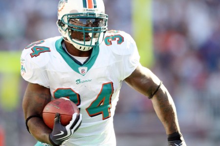  Ricky Williams #34 of the Miami Dolphins carries the ball in the second quarter against the New England Patriots on November 8, 2009 at Gillette Stadium in Foxboro, Massachusetts.  (Elsa/Getty Images)