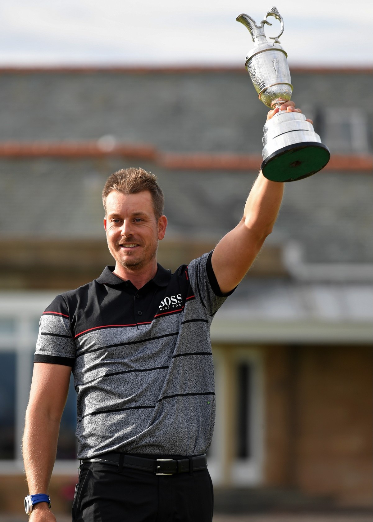 TROON, SCOTLAND - JULY 17: Henrik Stenson of Sweden celebrates victory as he poses with the Claret Jug on the the 18th green after the final round on day four of the 145th Open Championship at Royal Troon on July 17, 2016 in Troon, Scotland. Henrik Stenson of Sweden finished 20 under for the tournament to claim the Open Championship. (Photo by Stuart Franklin/Getty Images)