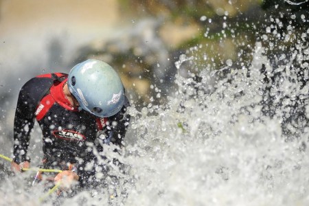 Canyoning sports Enthusiast playing on waterfall during 2nd National Canyoning Randezvous (NCR 2016) oraganized by Nepal Canyoning Association at Chahare Jharana (90 meters), Thanapati, Nuwakot, Nepal on June 3, 2016. Canyoning (known as canyoneering in the U.S.); Canyoning is a new adventure in water sport geared to the ultimate sports enthusiast. It is an activity that involves abseiling; sliding; jumping; swimming; and climbing down waterfalls through steep canyon walls to deep pools. (Photo by Narayan Maharjan/NurPhoto via Getty Images)