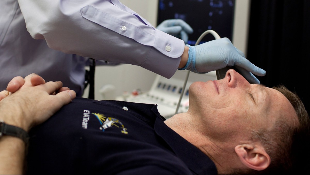NASA astronaut Chris Ferguson, STS-135 commander, has his eyes imaged using ultrasound as he undergoes an eye examination  at the Johnson Space Center Flight Medicine Clinic on Friday, March 11, 2011, in Houston.  (NASA Photo / Houston Chronicle, Smiley N. Pool)
