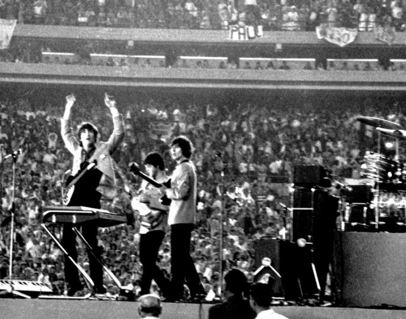 The Beatles perform at Shea Stadium, New York on 15th August 1965. (Photo by Michael Ochs Archives/Getty Images)