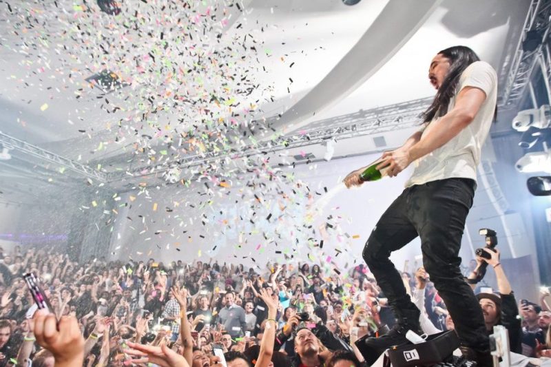 LOS ANGELES, CA - JANUARY 18: DJ Steve Aoki sprays the audience with champagne at his record release event celebrating "Wonderland" at SupperClub Los Angeles on January 18, 2012 in Los Angeles, California. (Photo by Chelsea Lauren/Getty Images)