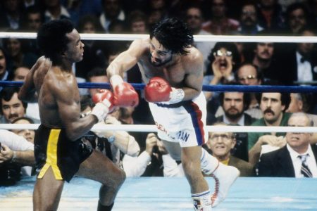 NEW ORLEANS - NOVEMBER 25,1980: Roberto Duran (R) leaps to land the punch against Sugar Ray Leonard during the fight at the Superdome in New Orleans, Louisiana. Sugar Ray Leonard  won the WBC welterweight title by a TKO 8. (Photo by: The Ring Magazine/Getty Images)