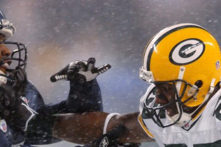 Packers receiver Greg Jennings straight arms Seahawks linebacker Kevin Bentley during a snowy Monday Night Football game between the Green Bay Packers and the Seattle Seahawks at Qwest Field in Seattle, Washington on November 27, 2006. (Kirby Lee/NFLPhotoLibrary)