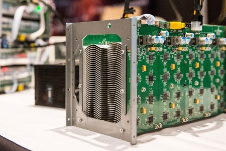 Bitcoin mining hardware is displayed at a Bitcoin conference on at the Javits Center April 7, 2014 in New York City. Topics included market places to trade bitcoin, mining hardware to harvest bitcoins and digital wallets to store bitcoins. Bitcoin is one of the most popular of over one hundred digital currencies that have recently come into popularity.  (Andrew Burton/Getty Images)