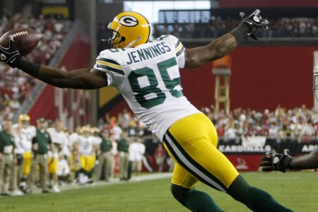GLENDALE, AZ - JANUARY 10:  Wide receiver Greg Jennings #85 of the Green Bay Packers catches the ball for a touchdown against the Arizona Cardinals during the third quarter of the 2010 NFC wild-card playoff game at University of Phoenix Stadium on January 10, 2010 in Glendale, Arizona.   (Photo by Jeff Gross/Getty Images)
