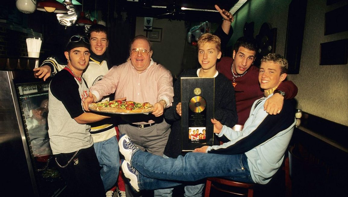 MIAMI - JUNE 06:    Lou Pearlman poses with N'Sync Chris Kirkpatrick,  JC Chasez,  Lance Bass,, Joey Fatone and Justin Timberlake seen at N.Y.P.D. pizza in Miami, circa 1996. (Photo by Mark Weiss/WireImage)