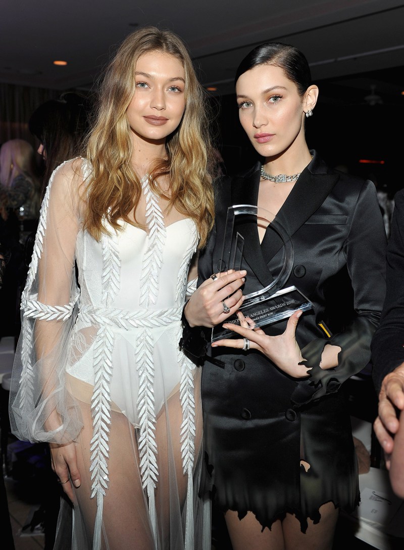 WEST HOLLYWOOD, CA - MARCH 20: EXCLUSIVE COVERAGE Models Gigi Hadid (L) and Bella Hadid, with her Model of the Year award, attend The Daily Front Row "Fashion Los Angeles Awards" 2016 at Sunset Tower Hotel on March 20, 2016 in West Hollywood, California. (Photo by Donato Sardella/Getty Images for The Daily Front Row)