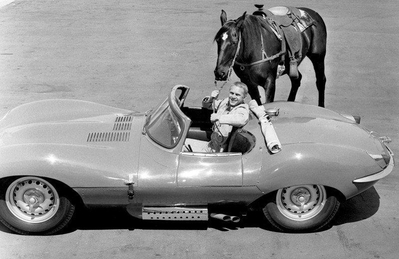 Steve McQueen with his horse and his Jaguar XK-SS, special racing model. (CBS via Getty Images)