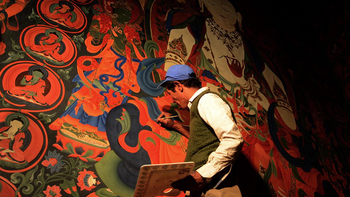 In this photograph taken on June 15, 2016, a Nepalese artist restores sacred murals in a monastry in Lo Manthang in Upper Mustang.
Deep in the heart of a medieval monastery in Nepal's remote Upper Mustang region, the battle to restore sacred murals and preserve traditional Tibetan Buddhist culture is in full swing. / AFP / PRAKASH MATHEMA / To go with 'Nepal-Tibet-Buddhism-Architecture-Painting' FEATURE by Ammu Kannampilly        (Photo credit should read PRAKASH MATHEMA/AFP/Getty Images)