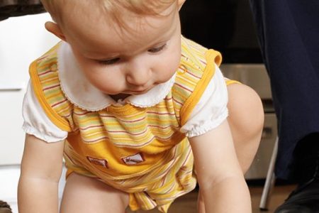 Child eating off floor. (Getty Images)