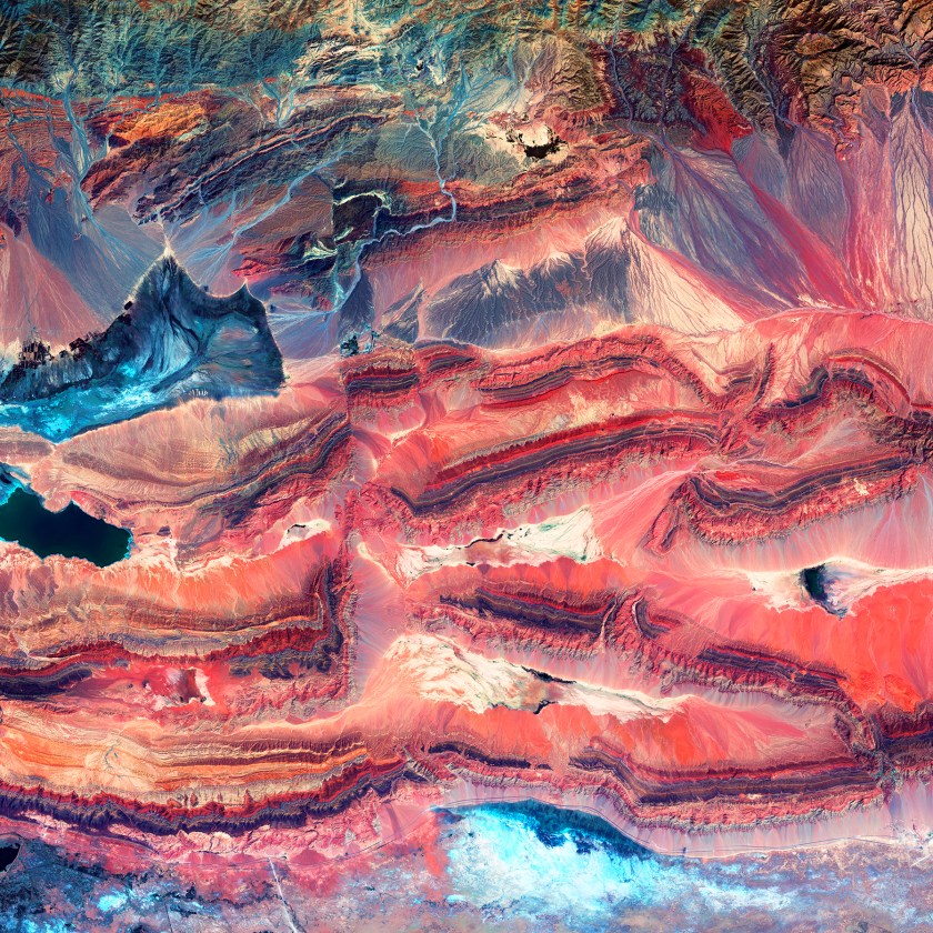 When landmasses collide, rock layers can break. Geologists call these breaks "faults." Rock layers are offset in this image in western China, making the faults remarkably clear. The different colors indicate rocks that formed at different times and in different environments.(USGS/NASA)