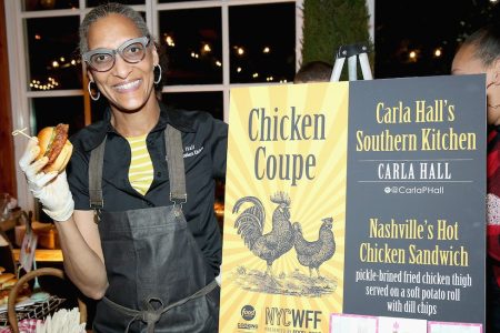 NEW YORK, NY - OCTOBER 15:  Carla Hall, Co-host of The Chew, and owner of Carla Halls Southern Kitchen poses with her dish; Nashville's Hot Chicken Sandwich at Chicken Coupe hosted by Whoopi Goldberg during Food Network & Cooking Channel New York City Wine & Food Festival presented by FOOD & WINE at The Loeb Boathouse on October 15, 2015 in New York City.  (Photo by Monica Schipper/Getty Images for NYCWFF)