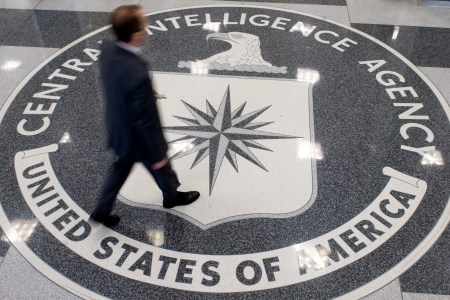 A man crosses the Central Intelligence Agency (CIA) logo in the lobby of CIA Headquarters in Langley, Virginia, on August 14, 2008. (Saul Loeb/AFP/Getty Images)