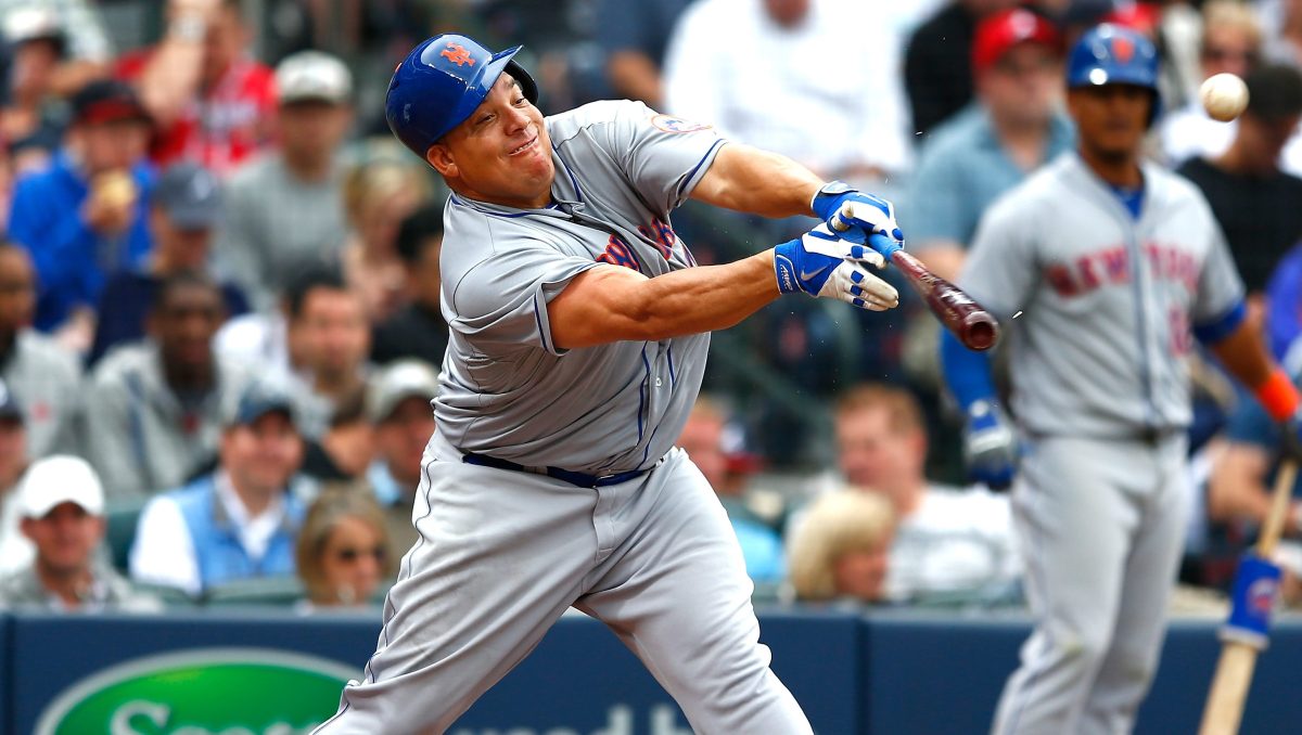 Bartolo Colon #40 of the New York Mets hits a RBI single into right field against the Atlanta Braves during the Braves opening series at Turner Field on April 12, 2015 in Atlanta, Georgia.  Wilmer Flores #4 scored on the single.  (Kevin C. Cox/Getty Images)