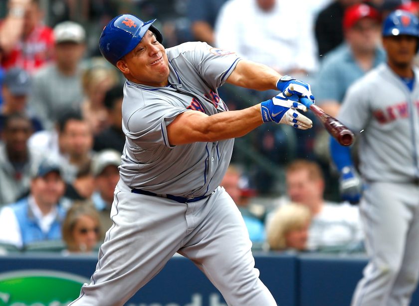 Bartolo Colon #40 of the New York Mets hits a RBI single into right field against the Atlanta Braves during the Braves opening series at Turner Field on April 12, 2015 in Atlanta, Georgia. Wilmer Flores #4 scored on the single. (Kevin C. Cox/Getty Images)