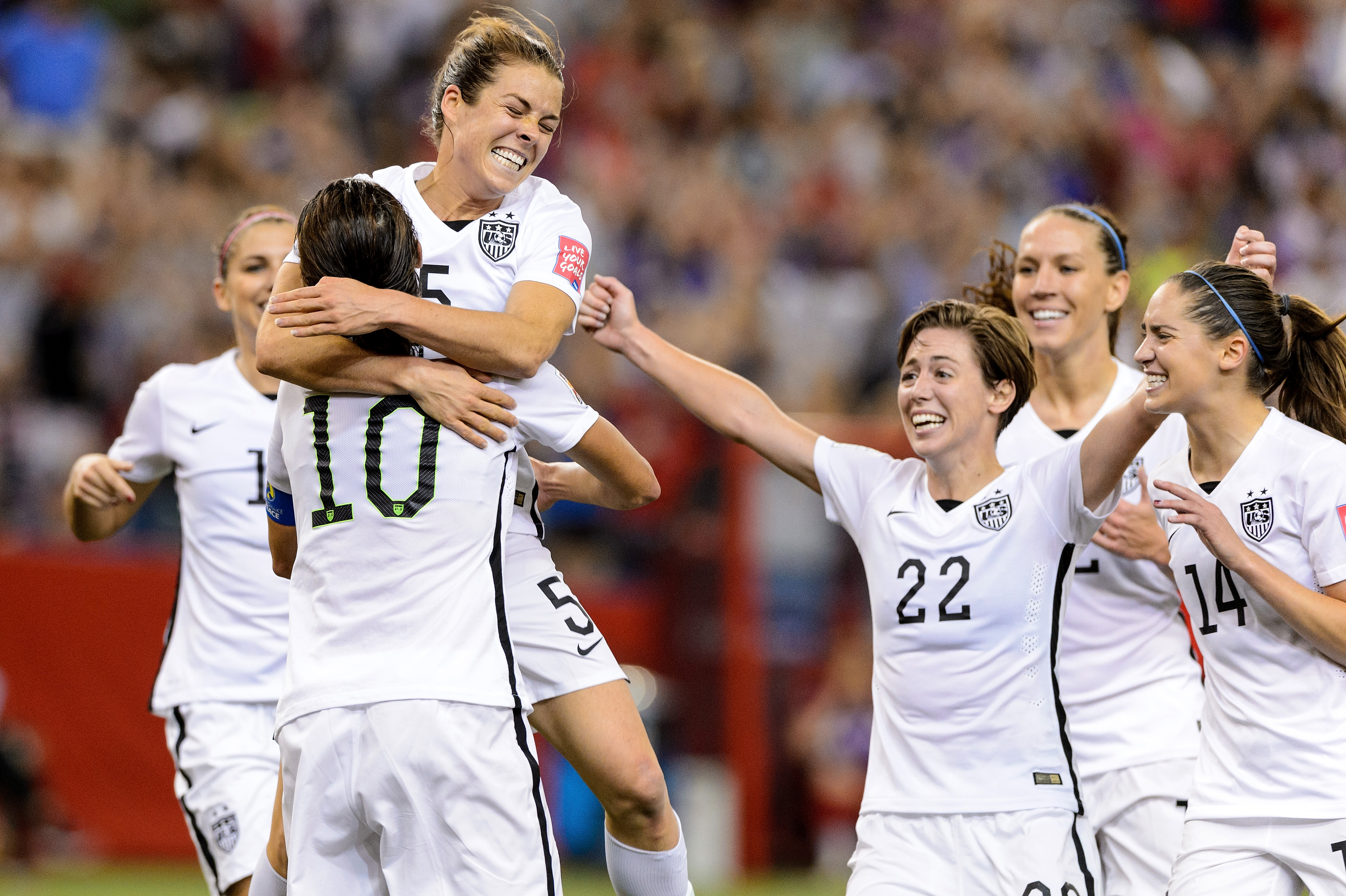 Kelley O'Hara #5 of the United States celebrates with teammates after scoring a goal in the second half against Germany in the FIFA Women's World Cup 2015 Semi-Final Match at Olympic Stadium on June 30, 2015 in Montreal, Canada.  (Photo by Minas Panagiotakis/Getty Images)