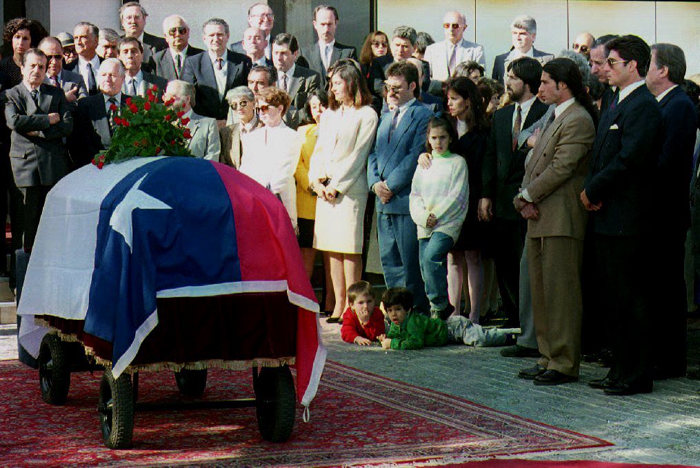 Relatives and friends of former Chilean Minister of Foreign Affairs Orlando Letelier gather next to the coffin bearing his remains on November 4,1992. Cris Bouronicle/AFP/Getty Images)