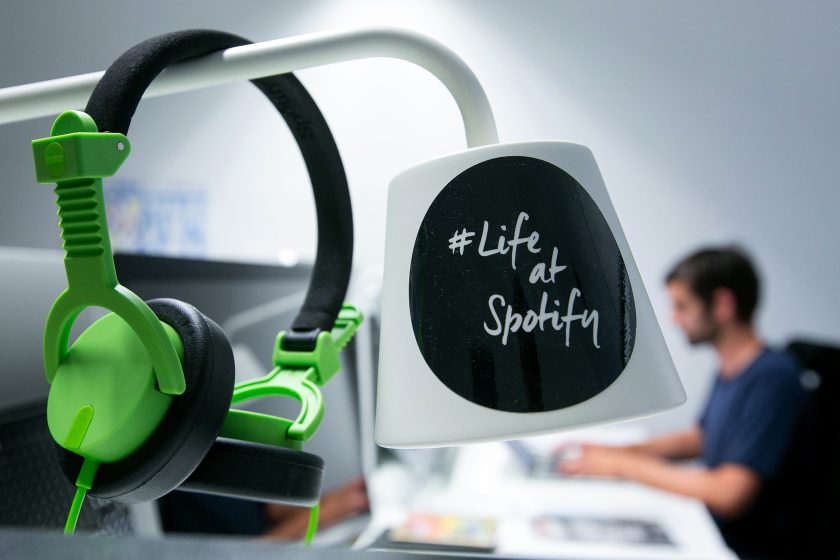 A pair of audio headphones hang from a lamp shade inside the offices music streaming company Spotify Ltd. (Krisztian Bocsi/Bloomberg via Getty Images)