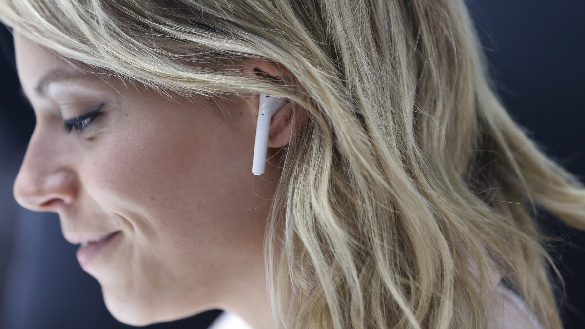 An attendee wears an Apple AirPods during a launch event on September 7, 2016 in San Francisco, California. Apple Inc. unveiled the latest iterations of its smart phone, the iPhone 7 and 7 Plus, the Apple Watch Series 2, as well as AirPods, the tech giant's first wireless headphones. (Stephen Lam/Getty Images)
