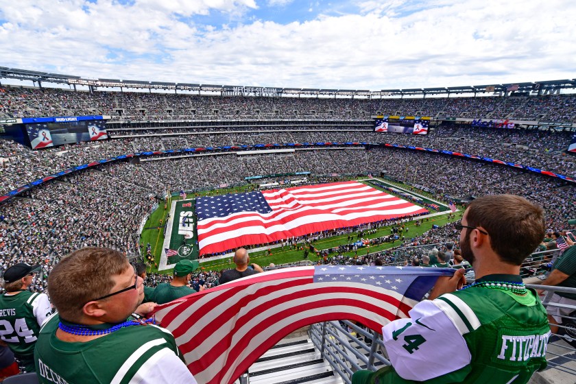 EAST RUTHERFORD, NJ - SEPTEMBER 11: Fans hold an American flag during the National Anthem prior to the game between the New York Jets and the Cincinnati Bengals at MetLife Stadium on September 11, 2016 in East Rutherford, New Jersey. (Photo by Steven Ryan/Getty Images)