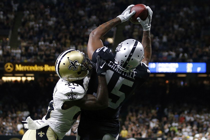 NEW ORLEANS, LA - SEPTEMBER 11: Michael Crabtree #15 of the Oakland Raiders catches a pass over Delvin Breaux #40 of the New Orleans Saints completing a two-point conversion to take the lead late in the second half of a game at Mercedes-Benz Superdome on September 11, 2016 in New Orleans, Louisiana. (Photo by Jonathan Bachman/Getty Images)