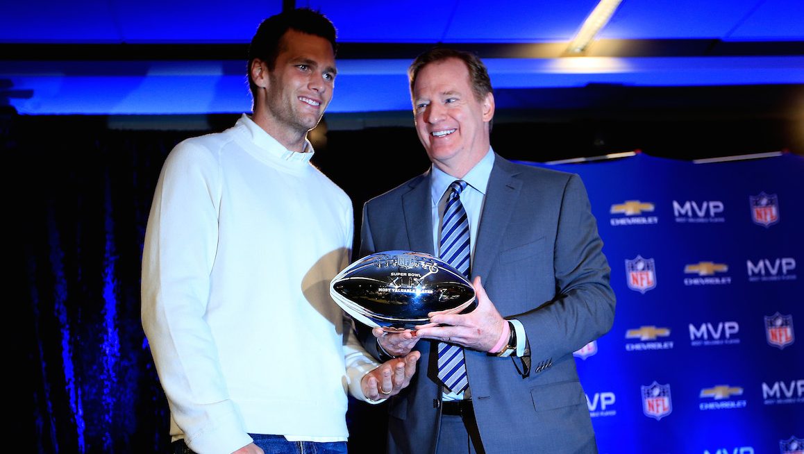 PHOENIX, AZ - FEBRUARY 02:  (L-R) Tom Brady of the New England Patriots with NFL Commissioner Roger Goodell and the Super Bowl XLIX MVP trophy during a press conference folowing the Patriots Super Bowl win over the Seattle Seahawks on February 2, 2015 in Phoenix, Arizona.  (Photo by Jamie Squire/Getty Images)
