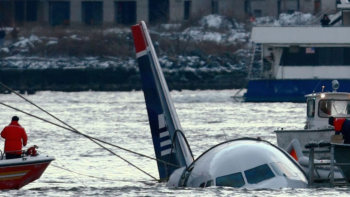  Rescue crews secure a US Airways flight 1549 floating in the water after it crashed into the Hudson River January 15, 2009 in New York City. The Airbus 320 craft crashed shortly after take-off from LaGuardia Airport heading to Charlotte, North Carolina. (Photo by Chris McGrath/Getty Images)